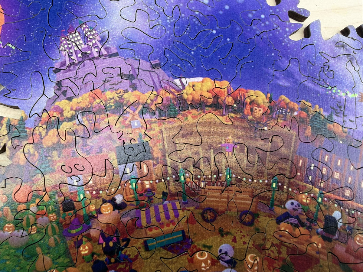 Close-up of the festival town meeting the starry purple sky, with organic laser-cut piece shapes